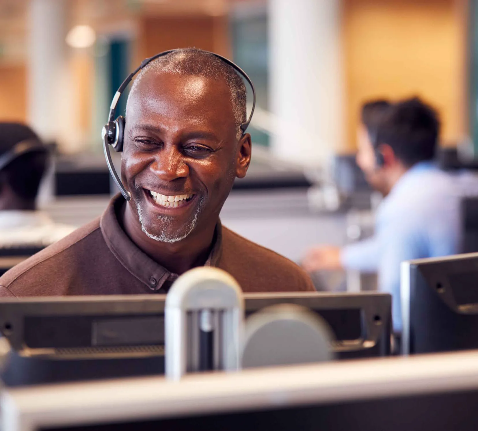 Business professional using a headset in an office